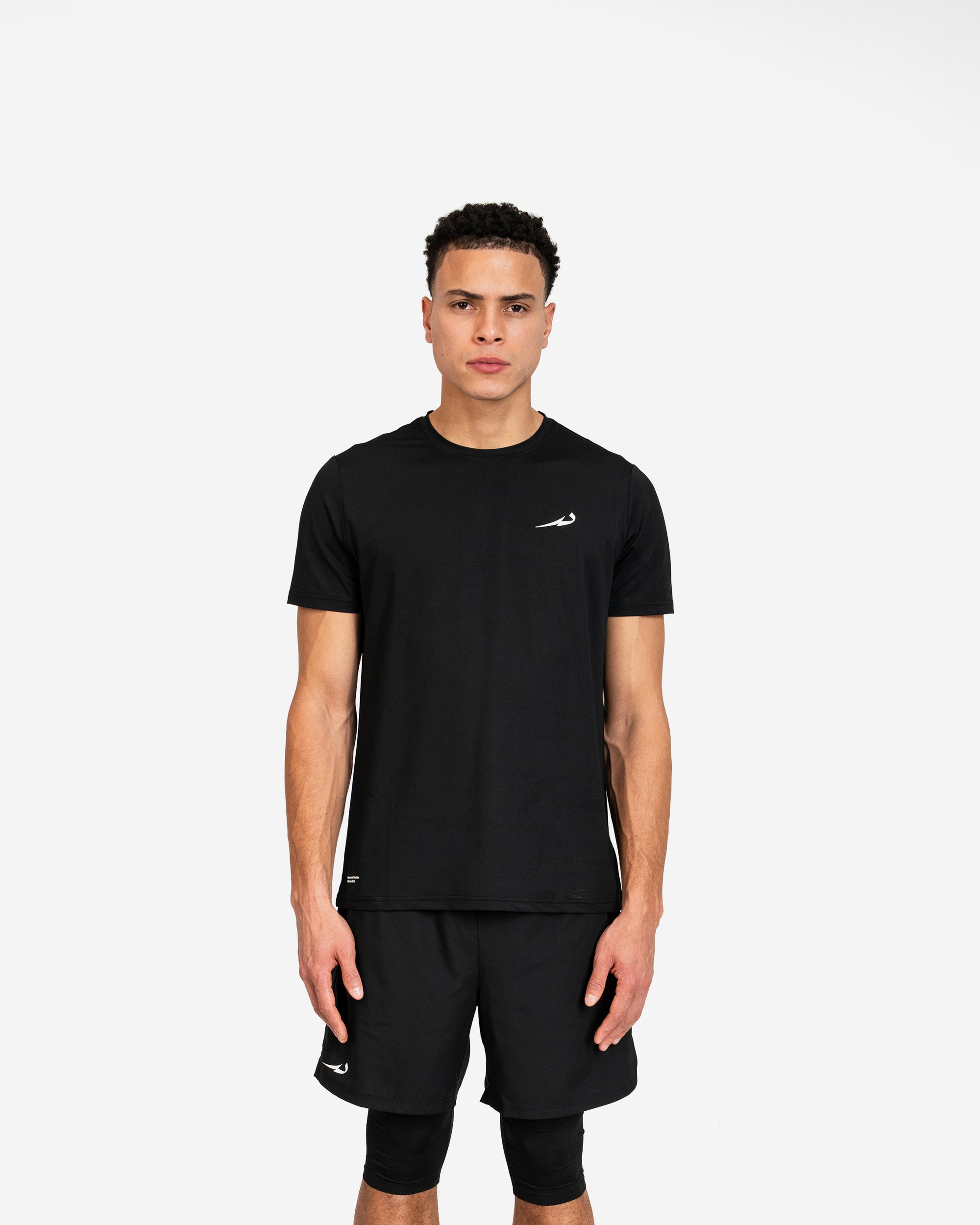 Man wearing a black athletic outfit with a deenathletic logo on a white background