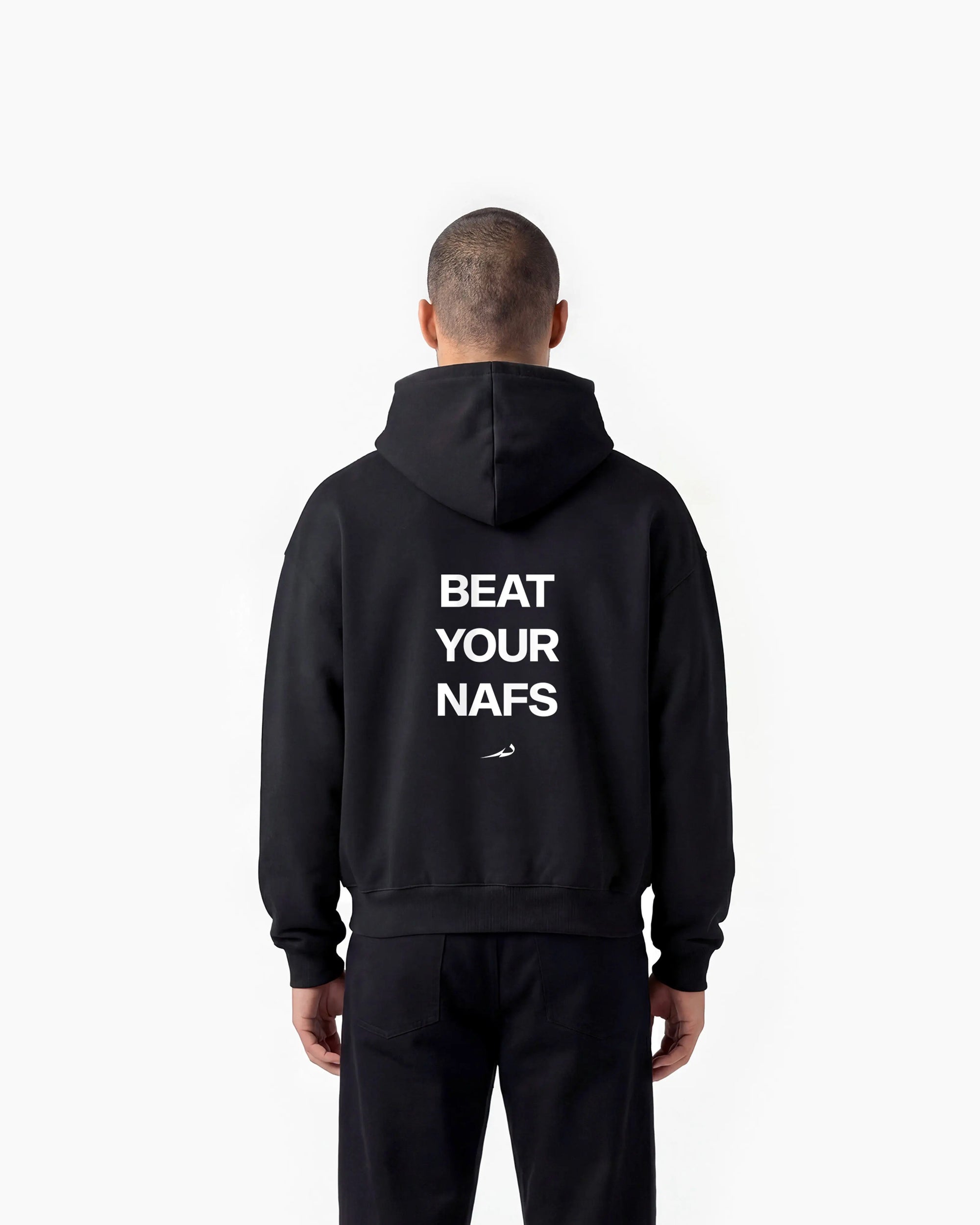 Person wearing a black hoodie with 'BEAT YOUR NAFS' text on the back against a white background