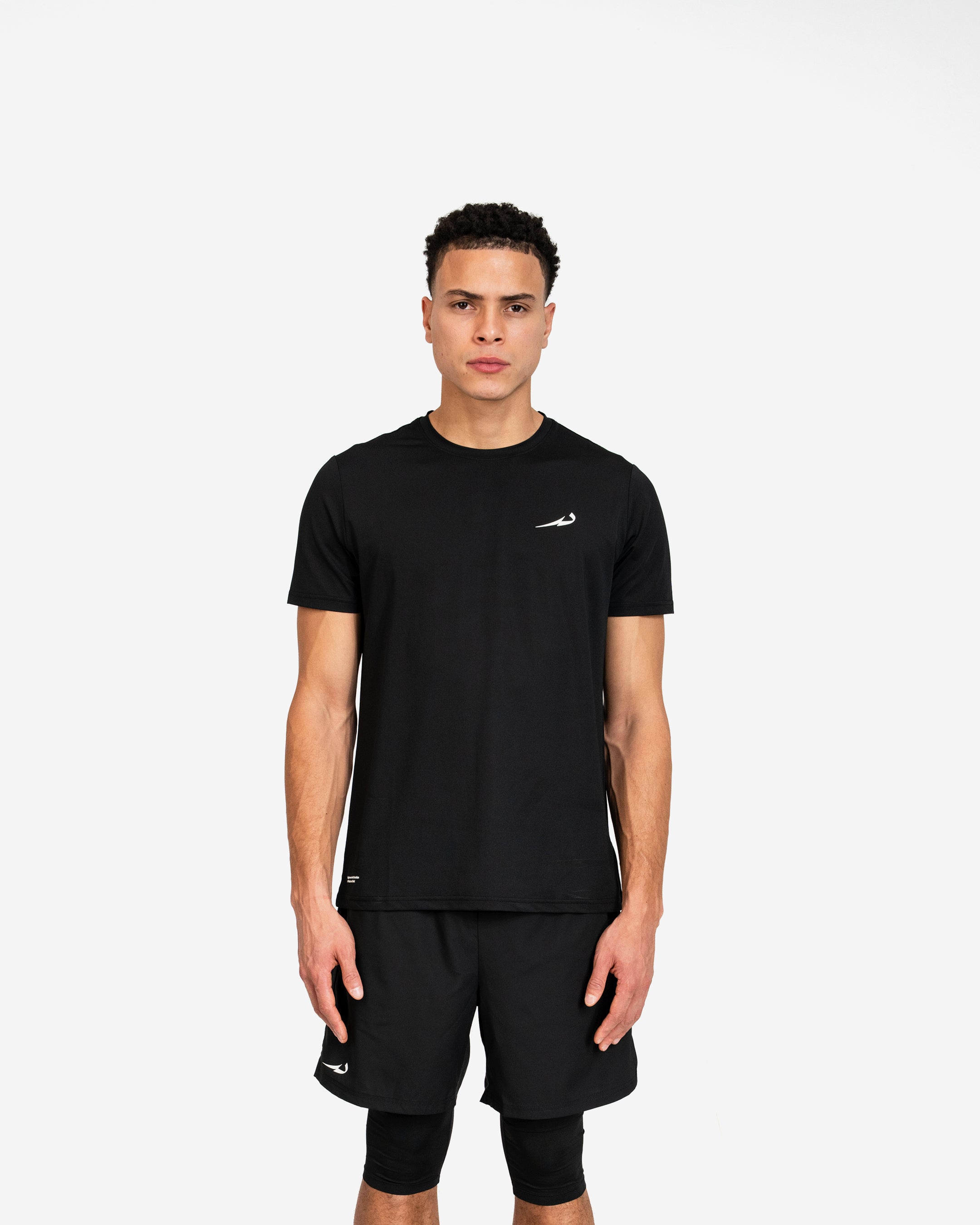 Man wearing a black athletic outfit with a deenathletic logo on a white background