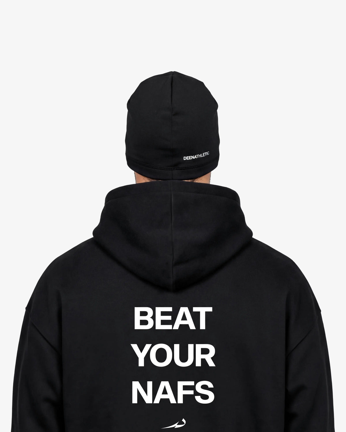 Man wearing a black beanie and hoodie with beat your nafs on a white background